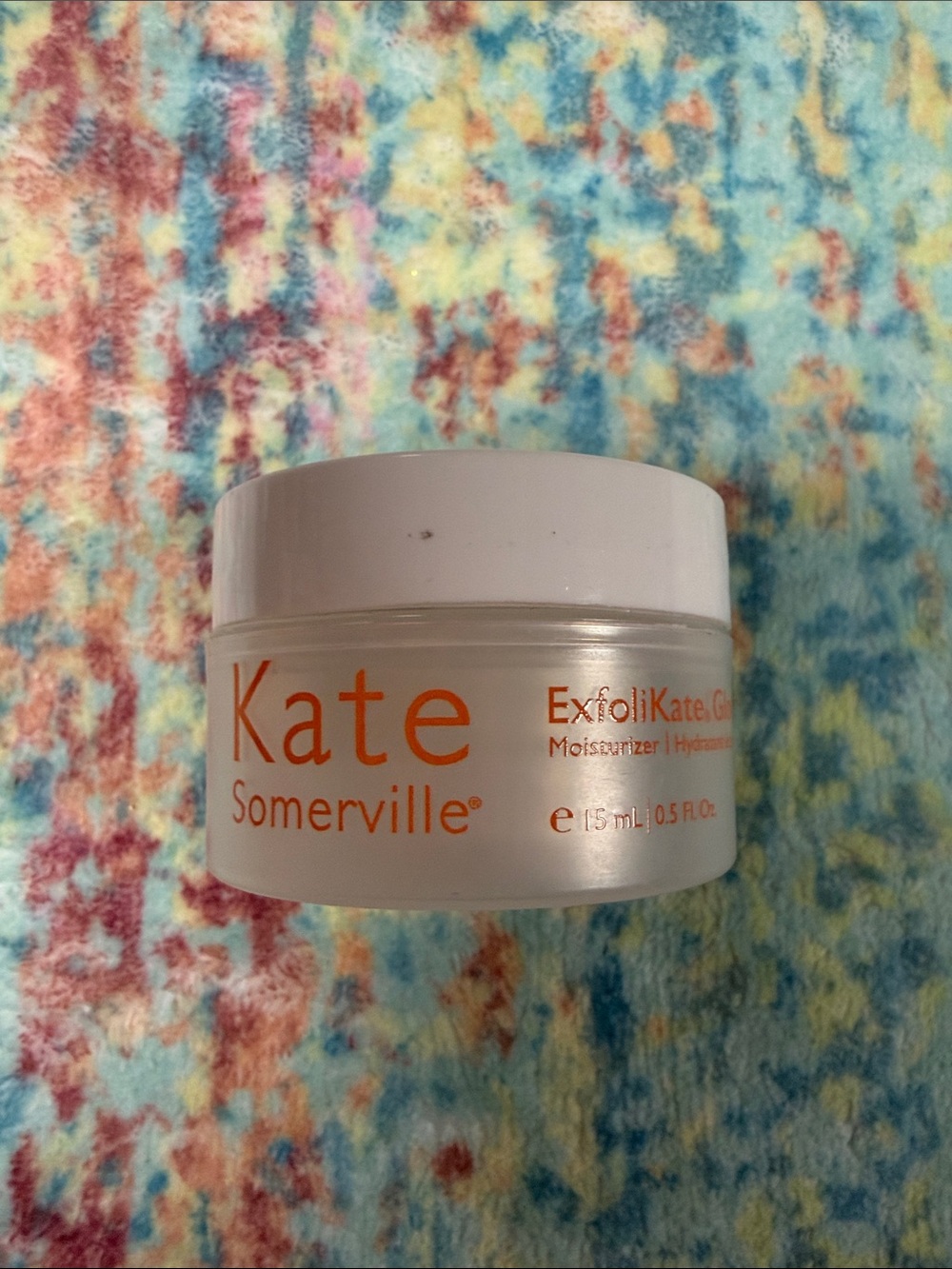 Kate Somerville Moisturizer Jar with White Lid and Orange Labeling